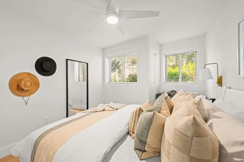 a bedroom with bed and a window