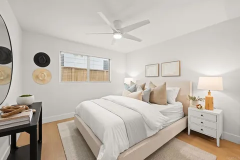 a bed room with a bed and a window