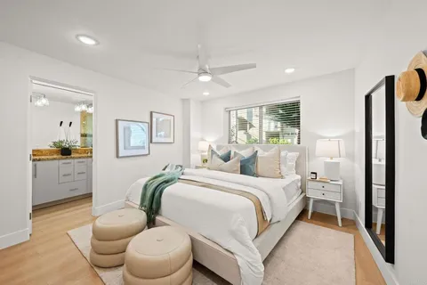 a bedroom with a bed and a view of bathroom