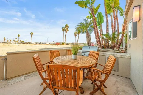 a dining table and chairs with the table and chairs