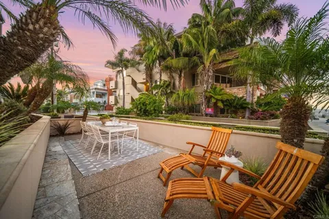 a view of swimming pool with outdoor seating and city view