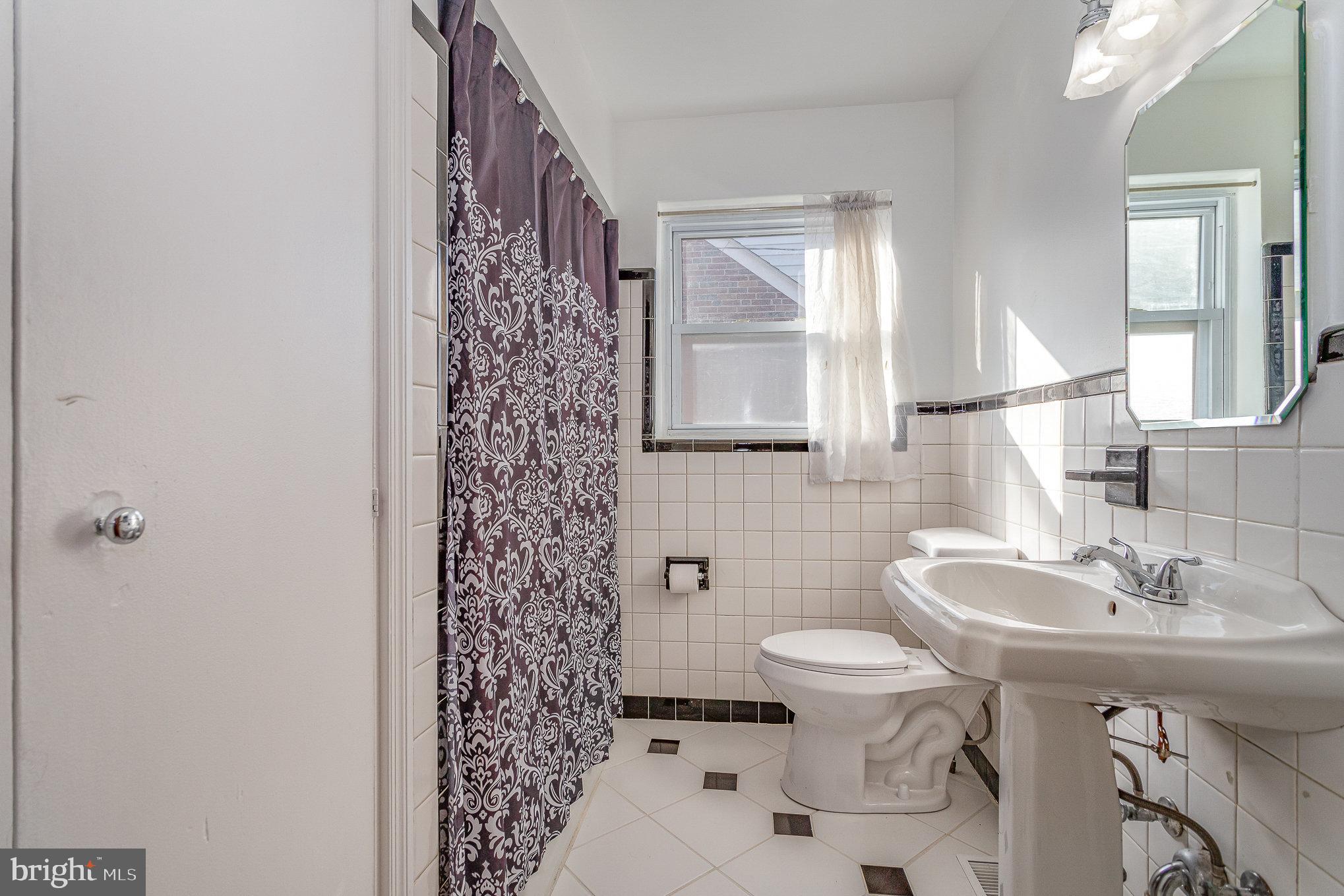 3914 Rutherford Street Harrisburg, PA 17111 - Photo 18 of 32 Full Bath with tile flooring & Laundry Shoot!