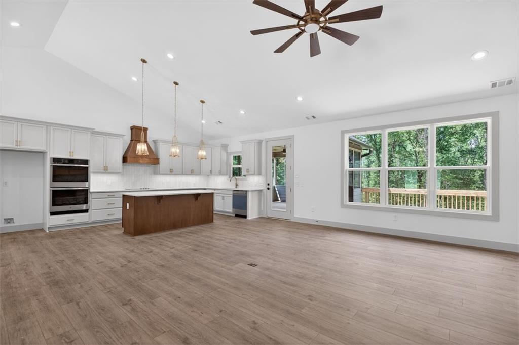 1416 Morgan Road Bremen, GA 30110 - Photo 32 of 32 a large kitchen with stainless steel appliances kitchen island a large counter top and a sink