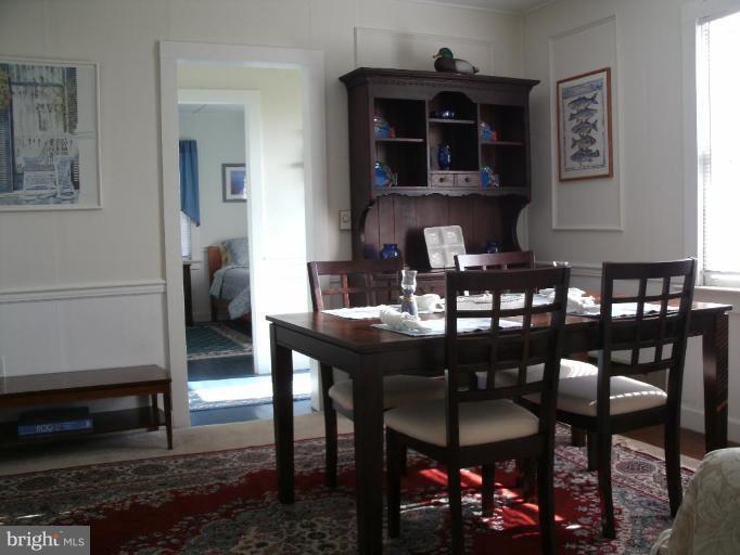 5791 Beach Road Rock Hall, MD 21661 - Photo 5 of 15 The dining room is to the left of the foyer
