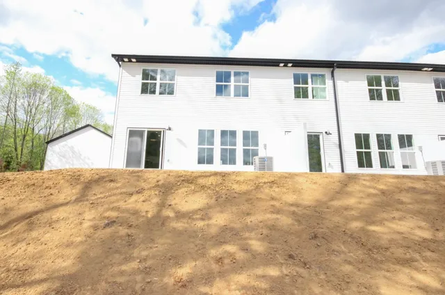 a view of an house with a backyard