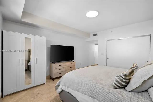 a bathroom with a tub double sink and mirror