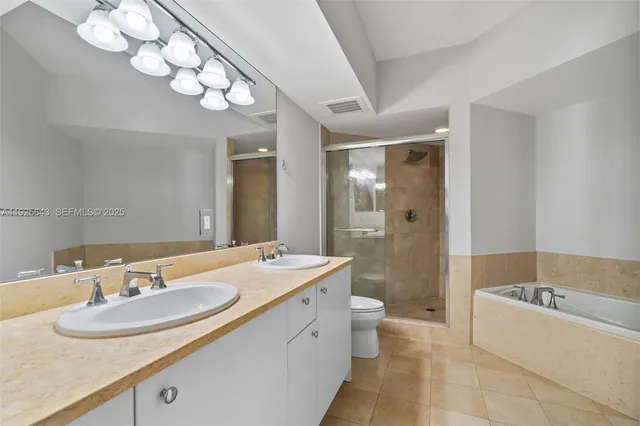 a bathroom with a bath tub and shower