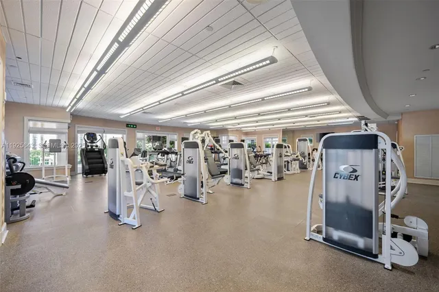 a large white building with a yard in front of it