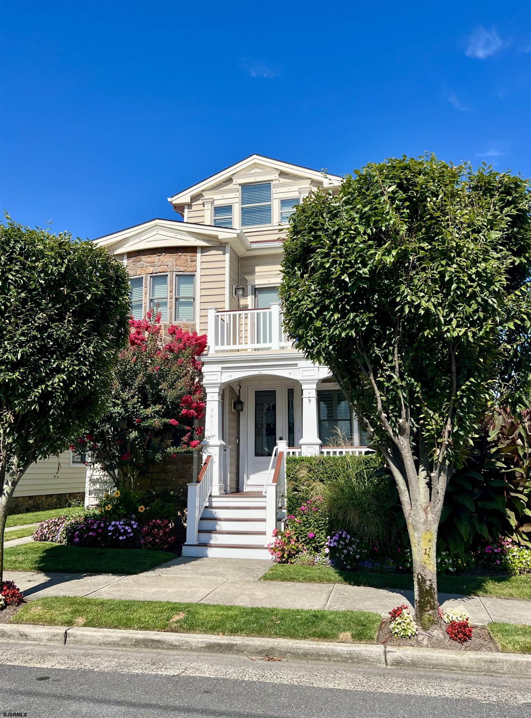 7611 Ventnor Avenue, Unit JUNE 2026 Margate City, NJ 08402 - Photo 47 of 49 a front view of a house with a yard