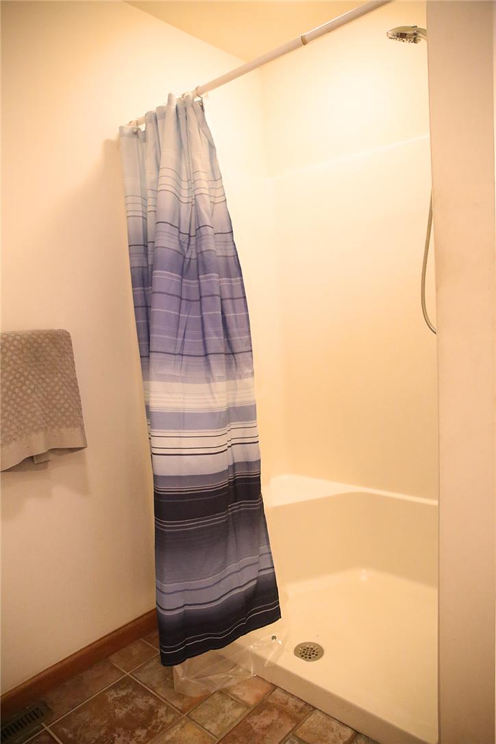 50 Anthony's Road White Haven, PA 18661 - Photo 39 of 57 A full shower stall with a striped curtain stands ready for refreshing use.