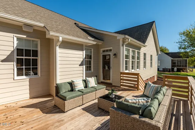 a view of a chairs and table in backyard