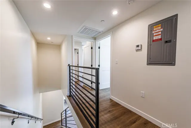 a view of a hallway with stairs