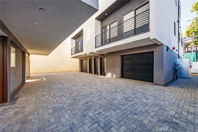 a view of a house with a yard and garage