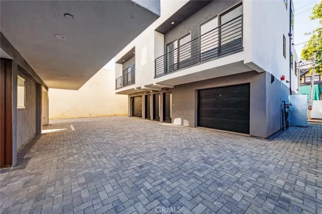 a view of a house with a yard and garage