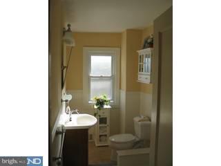283 West Valley Road Wayne, PA 19087 - Photo 5 of 6 a bathroom with a sink a toilet and shower