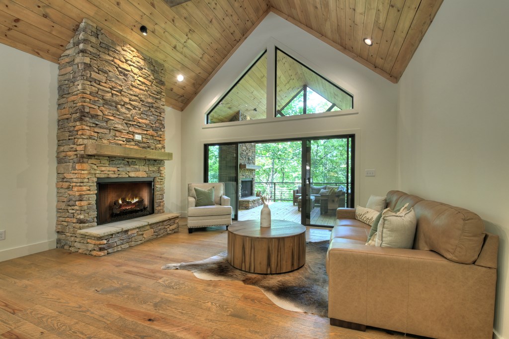 187 Chickadee Road Morganton, GA 30560 - Photo 17 of 94 a living room with furniture and a fireplace