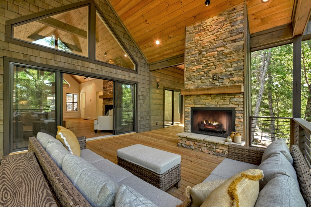 187 Chickadee Road Morganton, GA 30560 - Photo 2 of 94 a living room with furniture large windows and a fireplace