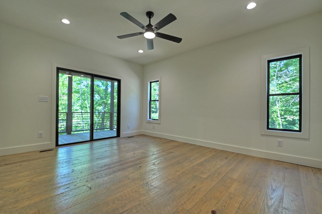 187 Chickadee Road Morganton, GA 30560 - Photo 33 of 94 wooden floor in an empty room with a window