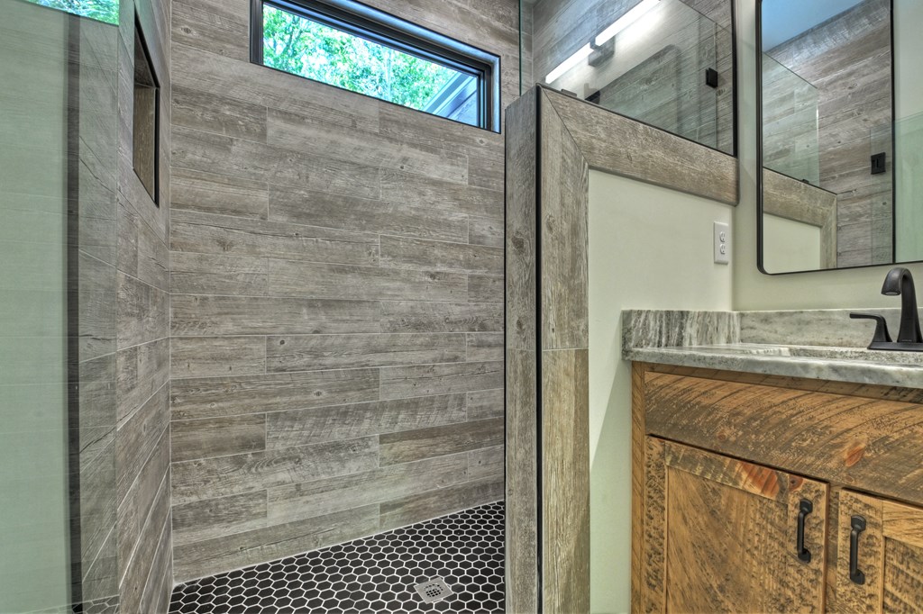 187 Chickadee Road Morganton, GA 30560 - Photo 35 of 94 a bathroom with a granite countertop shower