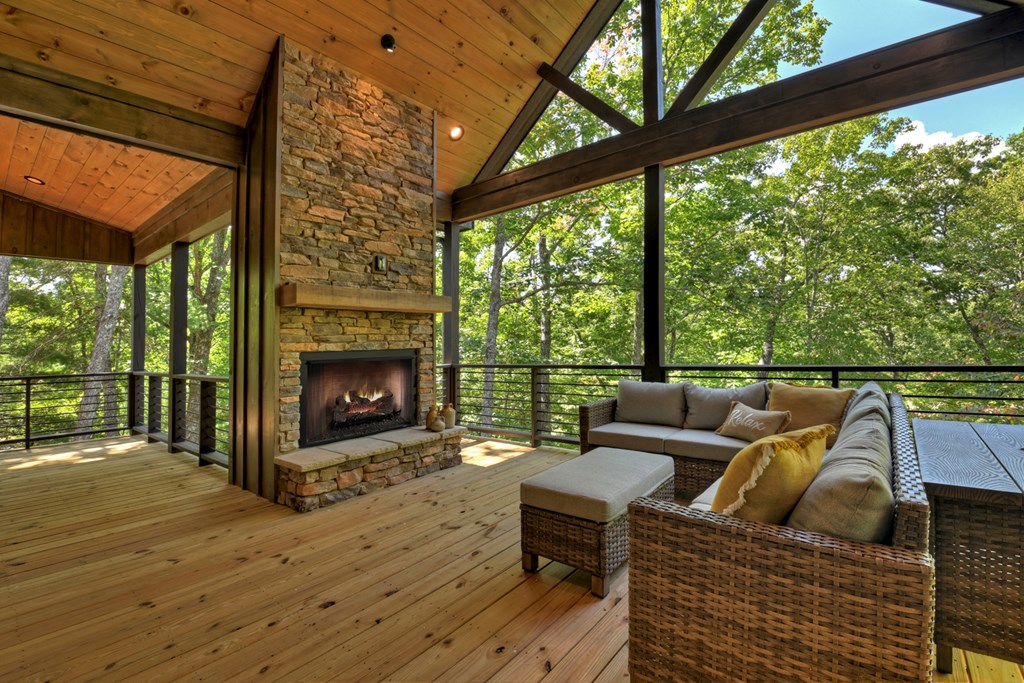 187 Chickadee Road Morganton, GA 30560 - Photo 60 of 94 a roof deck with couches and wooden floor