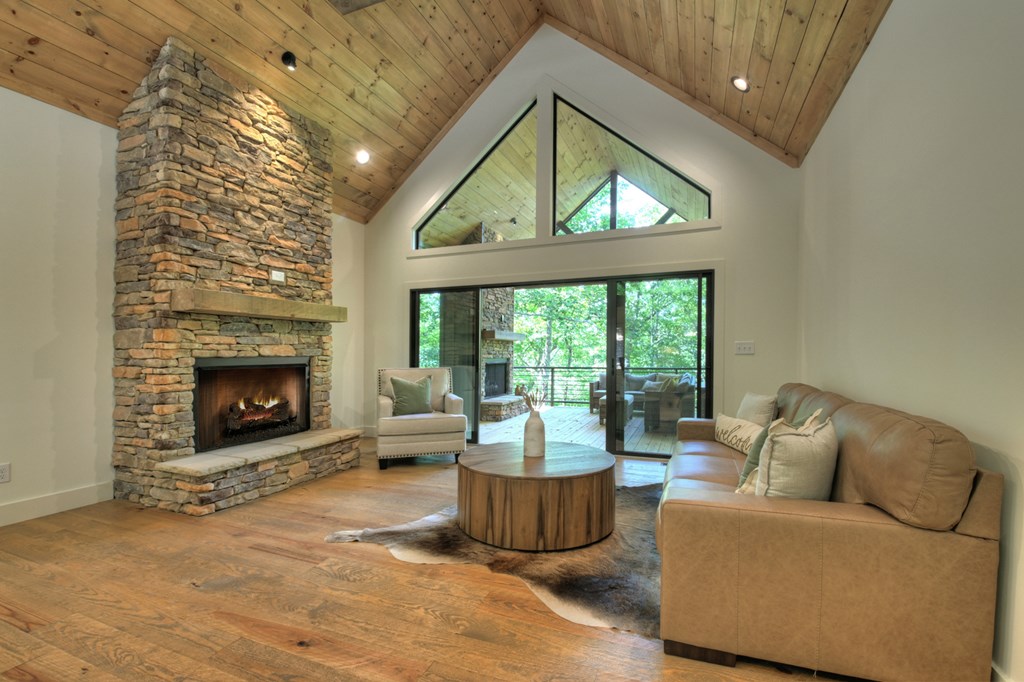 187 Chickadee Road Morganton, GA 30560 - Photo 63 of 94 a living room with furniture and a fireplace