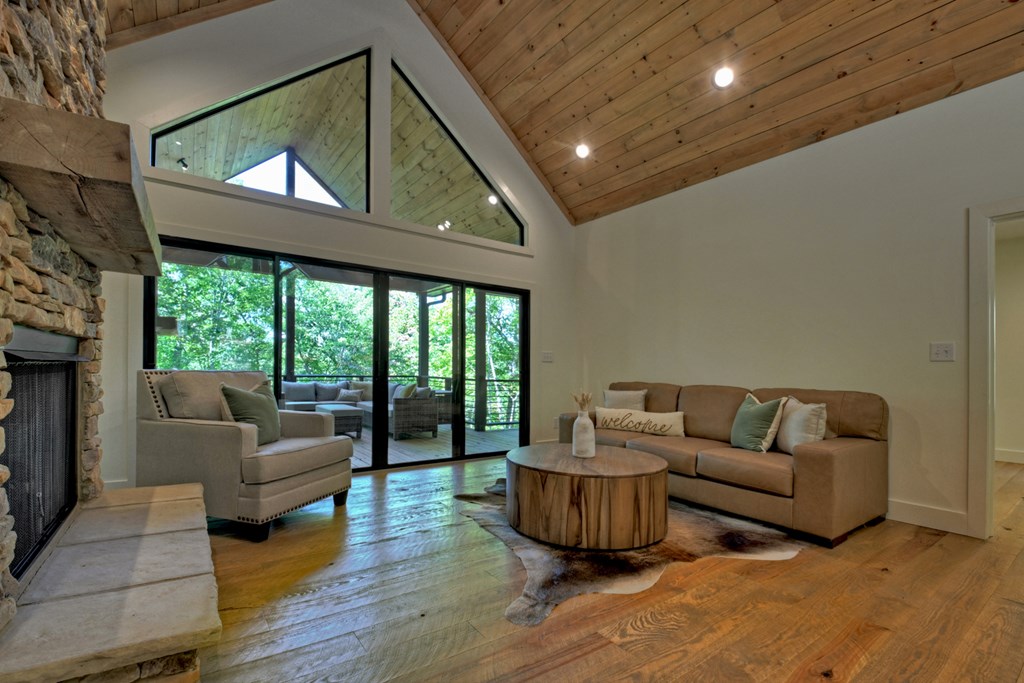 187 Chickadee Road Morganton, GA 30560 - Photo 65 of 94 a living room with furniture and a fireplace