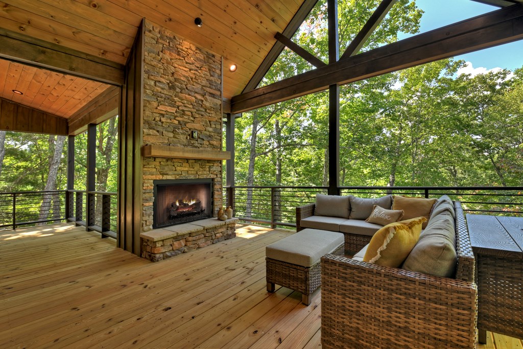 187 Chickadee Road Morganton, GA 30560 - Photo 8 of 94 a roof deck with couches and wooden floor