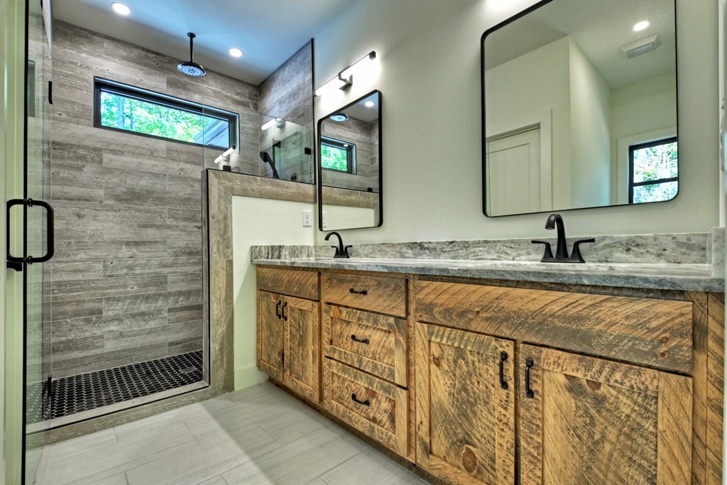 187 Chickadee Road Morganton, GA 30560 - Photo 82 of 94 a bathroom with double sink and a mirror