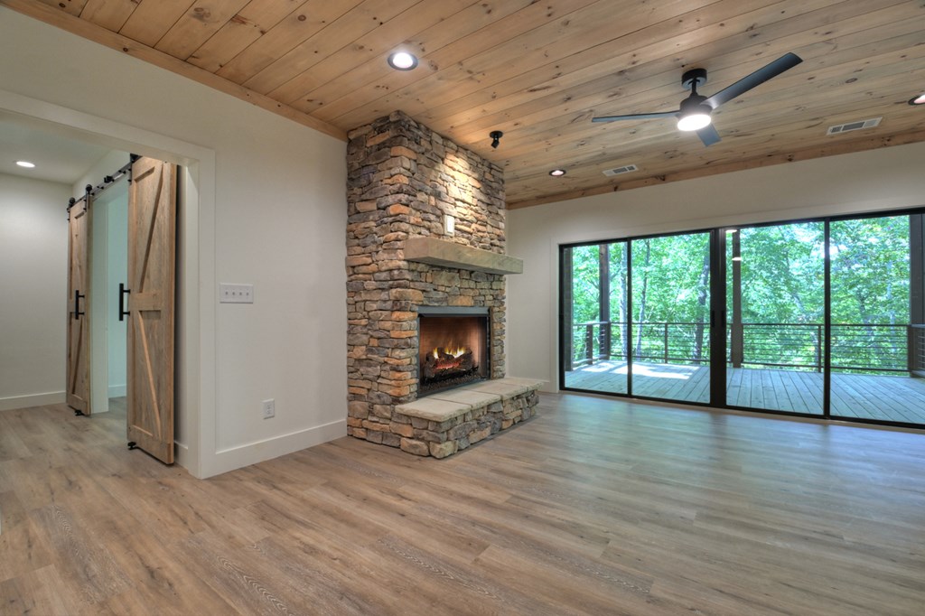187 Chickadee Road Morganton, GA 30560 - Photo 86 of 94 a view of an empty room with a fireplace and a window