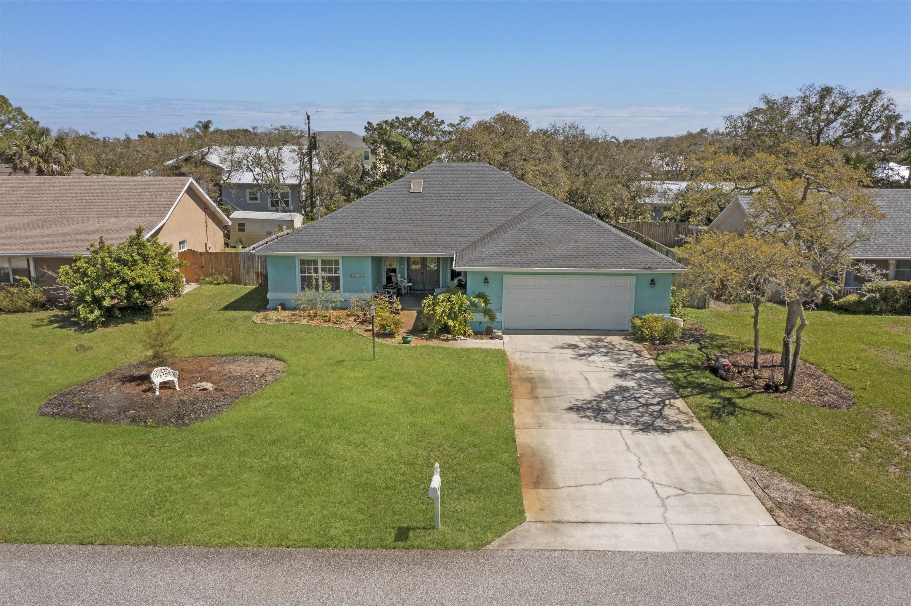 5372 5th Street St. Augustine, FL 32080 - Photo 1 of 46 a front view of a house with garden