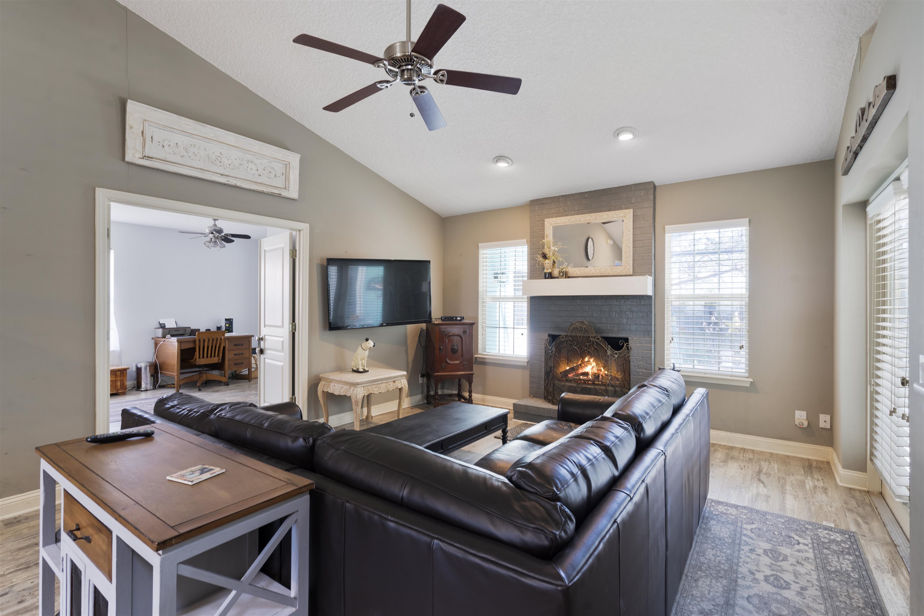 5372 5th Street St. Augustine, FL 32080 - Photo 12 of 46 a living room with furniture and a fireplace
