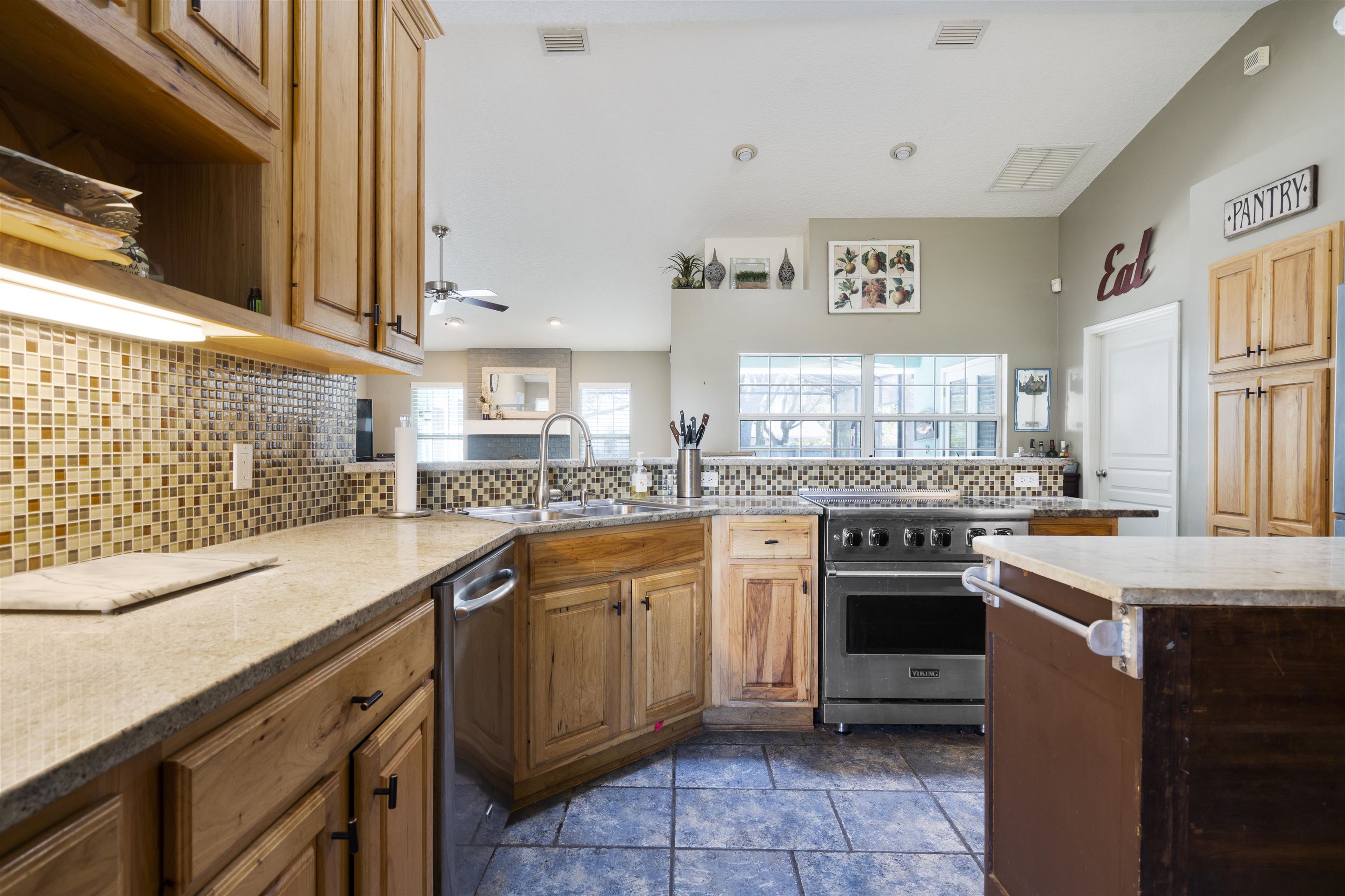 5372 5th Street St. Augustine, FL 32080 - Photo 15 of 46 a kitchen with stainless steel appliances granite countertop a sink and a stove