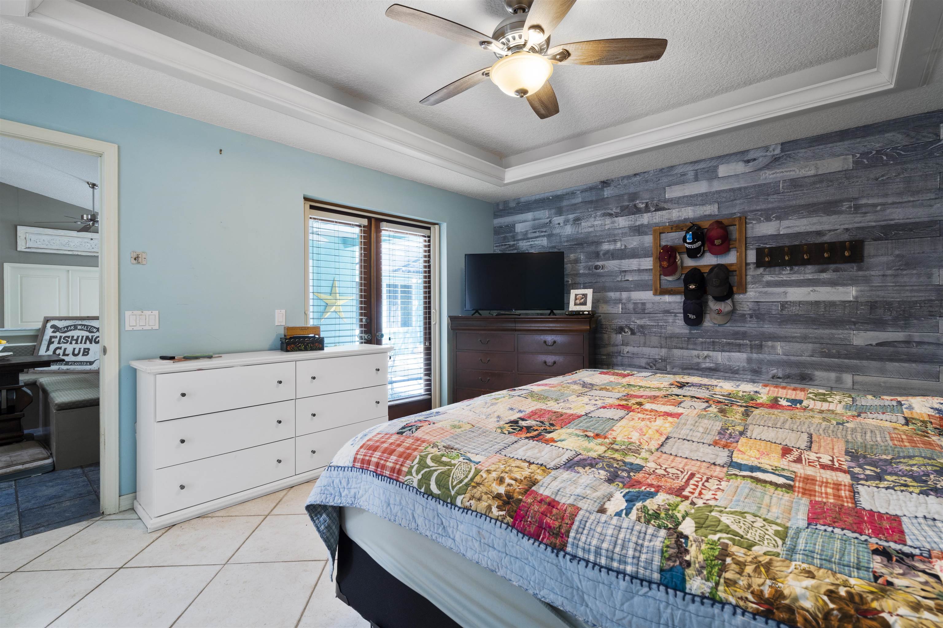 5372 5th Street St. Augustine, FL 32080 - Photo 20 of 46 a bedroom with a bed and a dresser in it