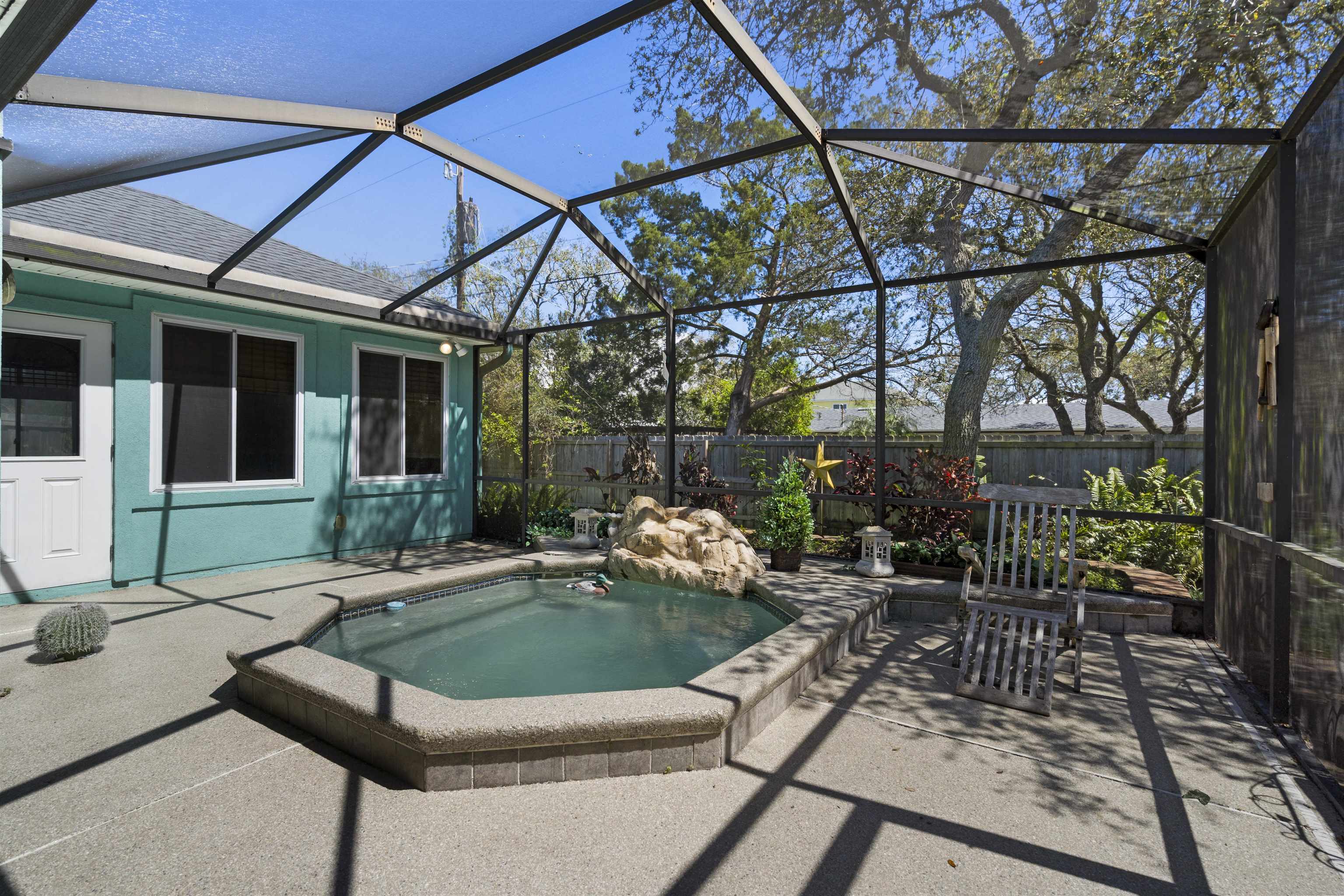 5372 5th Street St. Augustine, FL 32080 - Photo 2 of 46 a view of a patio with couches table and chairs and potted plants
