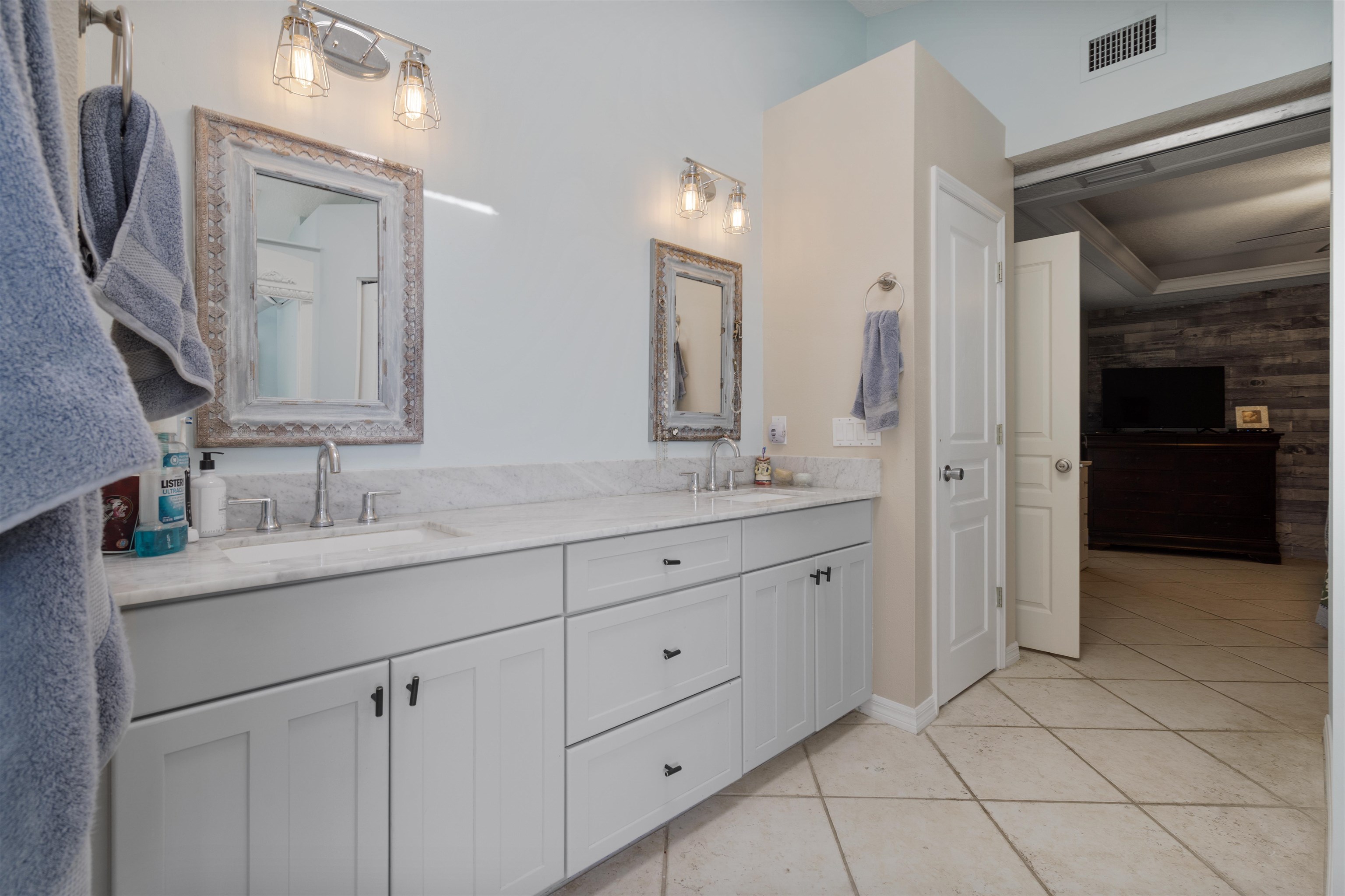 5372 5th Street St. Augustine, FL 32080 - Photo 22 of 46 a bathroom with a granite countertop sink mirror and double