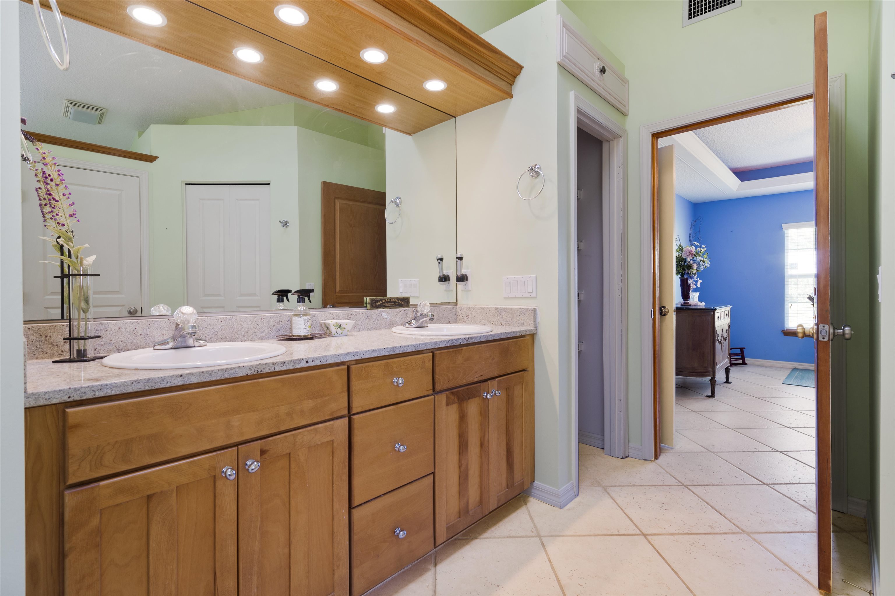 5372 5th Street St. Augustine, FL 32080 - Photo 25 of 46 a bathroom with a sink and a mirror