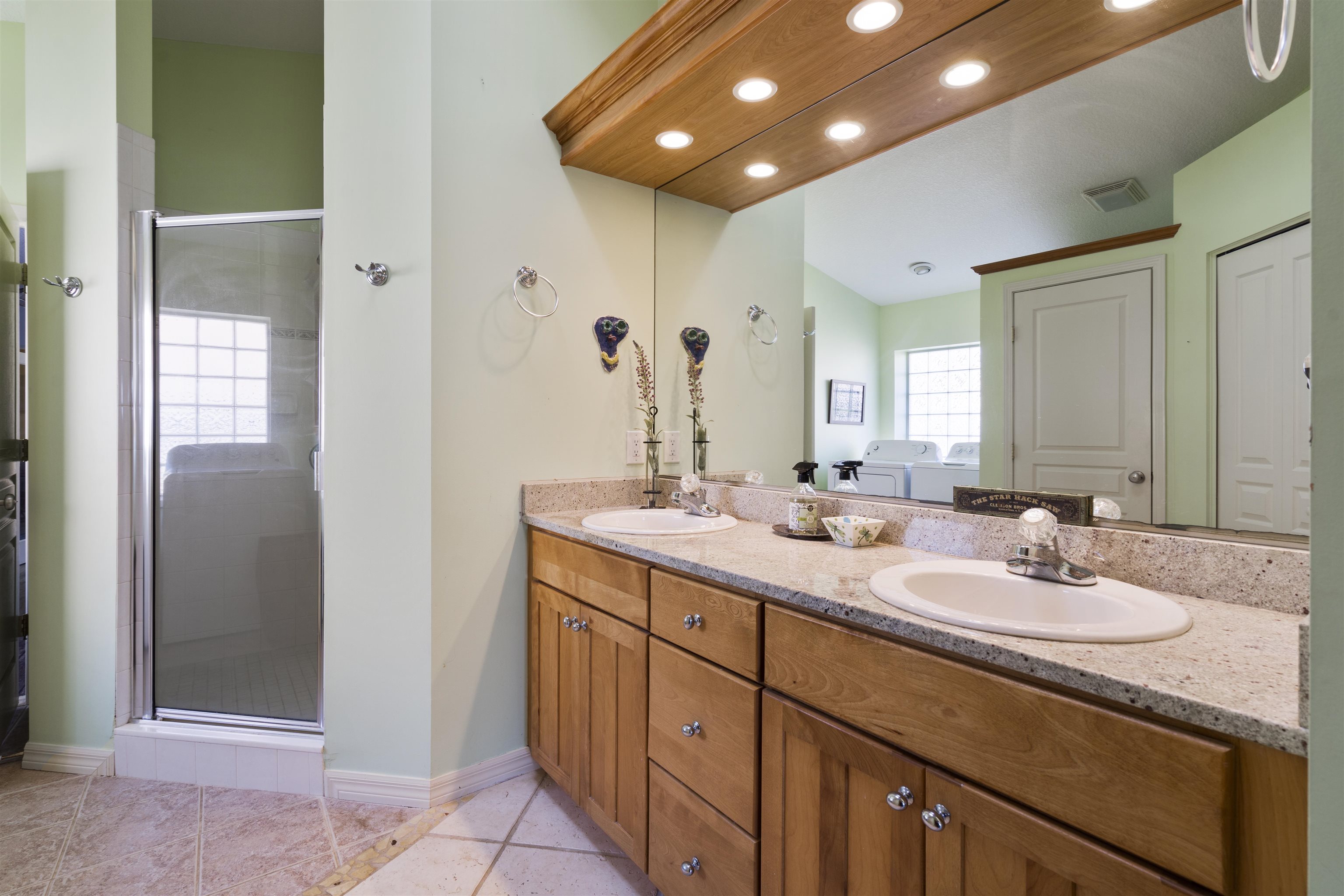 5372 5th Street St. Augustine, FL 32080 - Photo 26 of 46 a bathroom with a double vanity sink and a mirror