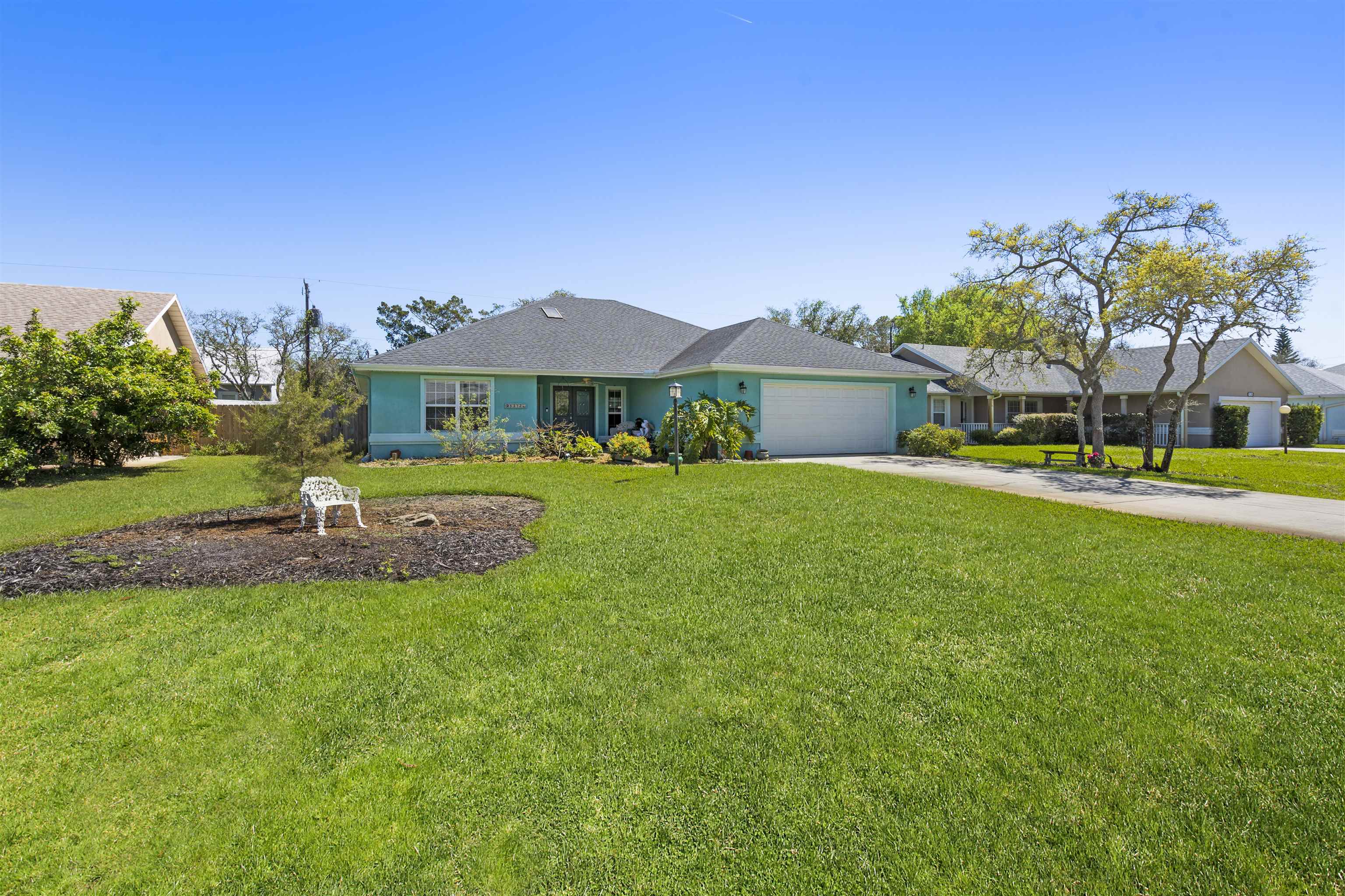 5372 5th Street St. Augustine, FL 32080 - Photo 42 of 46 a view of a house with a big yard and potted plants