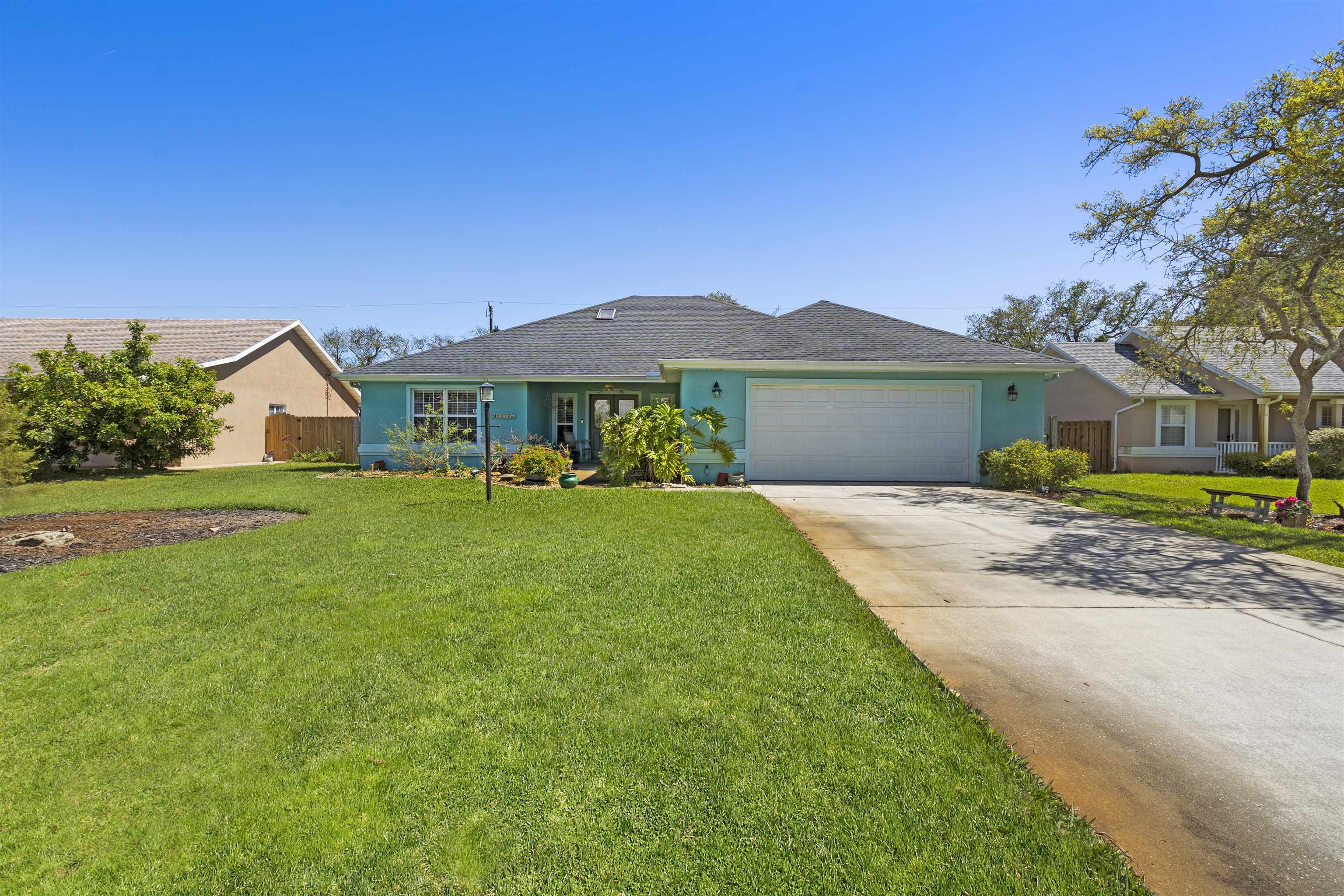 5372 5th Street St. Augustine, FL 32080 - Photo 7 of 46 a front view of a house with garden