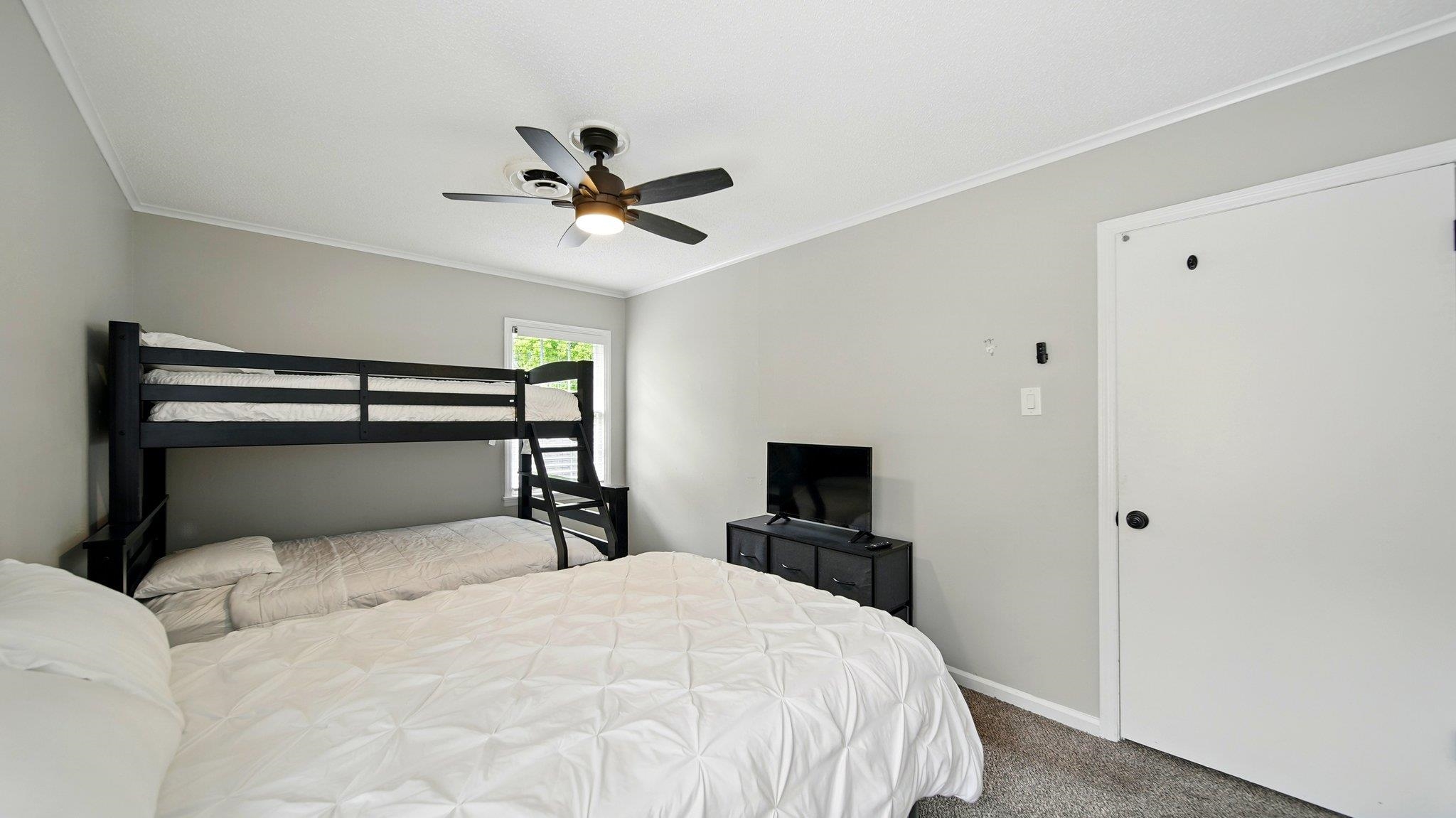 359 South Fenwick Road Memphis, TN 38111 - Photo 17 of 31 Carpeted bedroom with crown molding and a ceiling fan