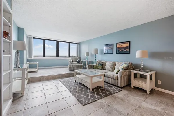 a living room with furniture and a rug