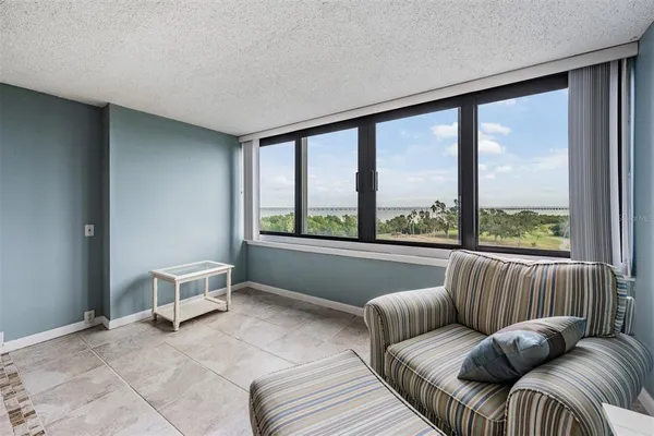 a living room with furniture and a large window