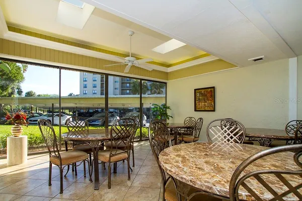 a living room with a couch and chairs