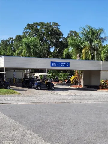 a view of a house with swimming pool and a yard