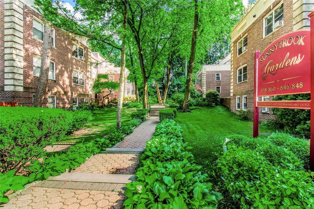 858 Palmer Road, Unit 3B Bronxville, NY 10708 - Photo 1 of 1 a view of a street with a building and a street sign
