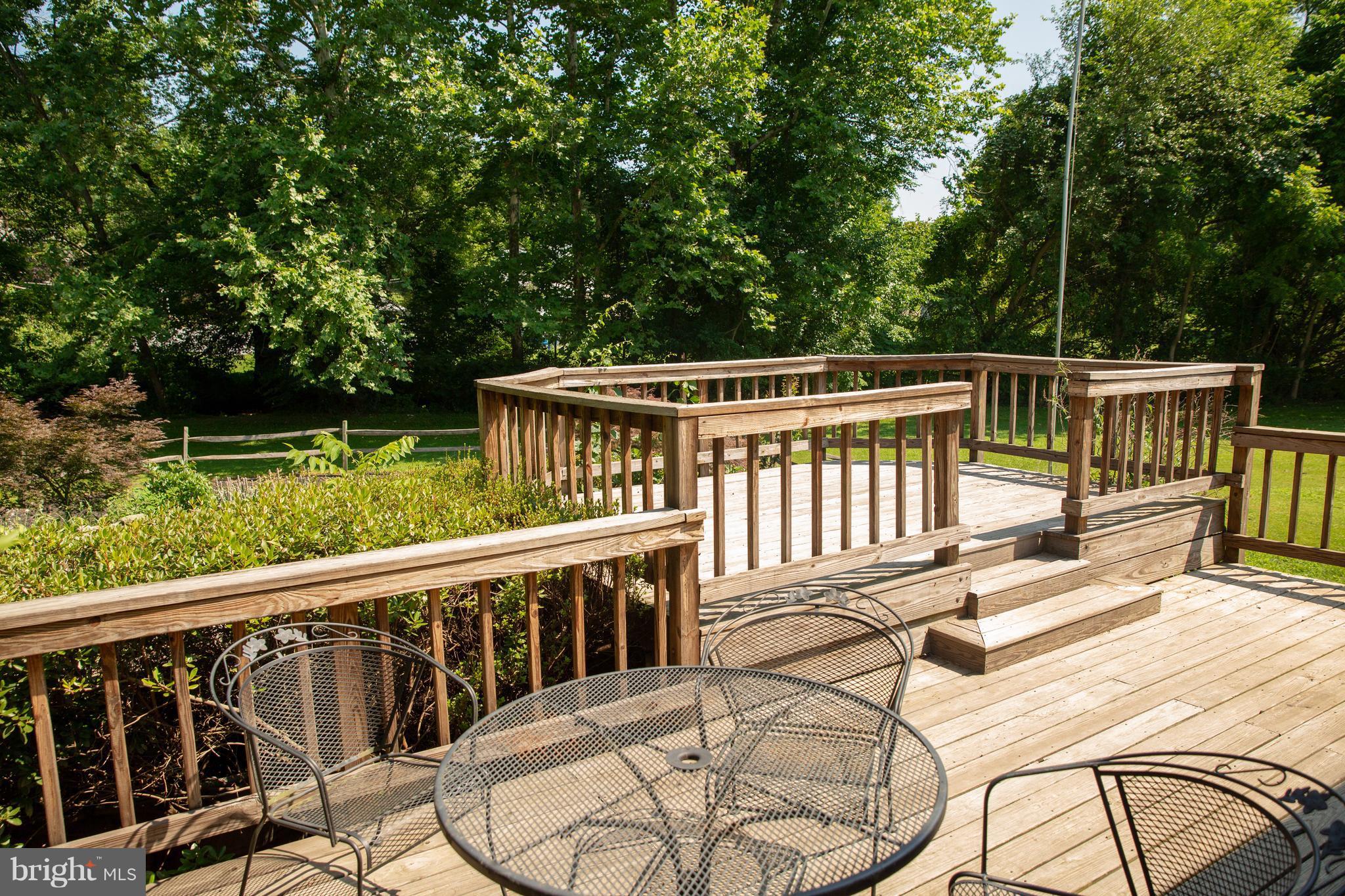 7721 Gaither Road Sykesville, MD 21784 - Photo 13 of 27 Large deck overlooking beautiful garden w pond