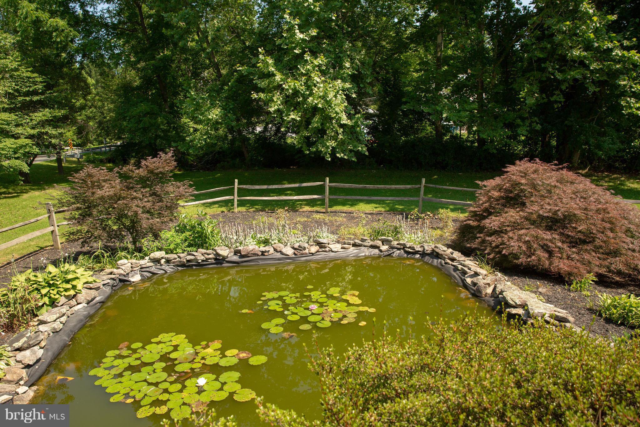 7721 Gaither Road Sykesville, MD 21784 - Photo 15 of 27 Pond & beautiful gardening off back of home