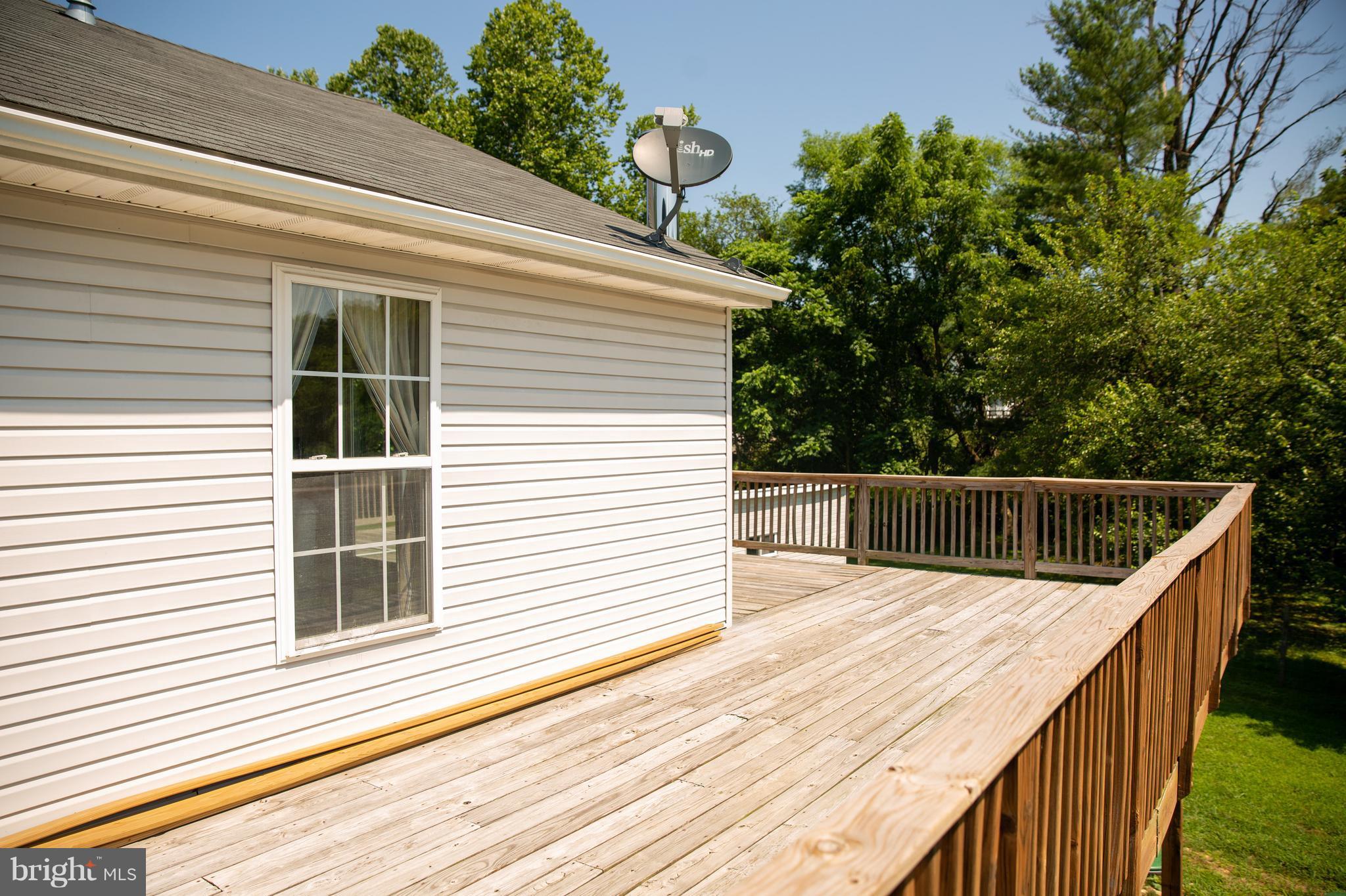7721 Gaither Road Sykesville, MD 21784 - Photo 20 of 27 Wrap around deck on 2nd home above large garage
