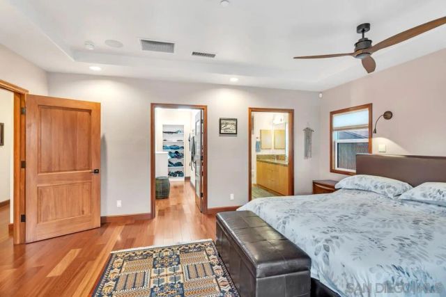 a bathroom with a granite countertop shower sink and mirror
