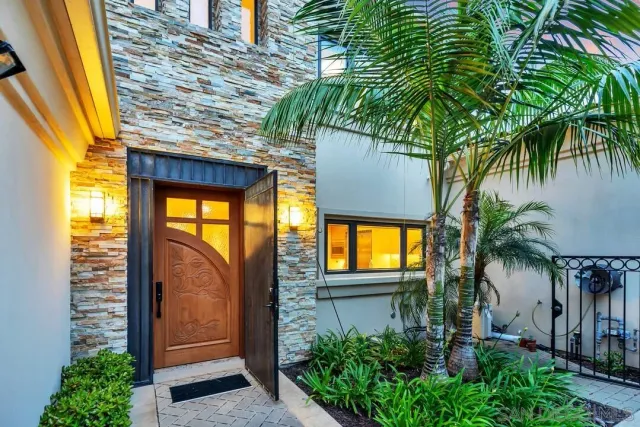 a view of a house with a small yard